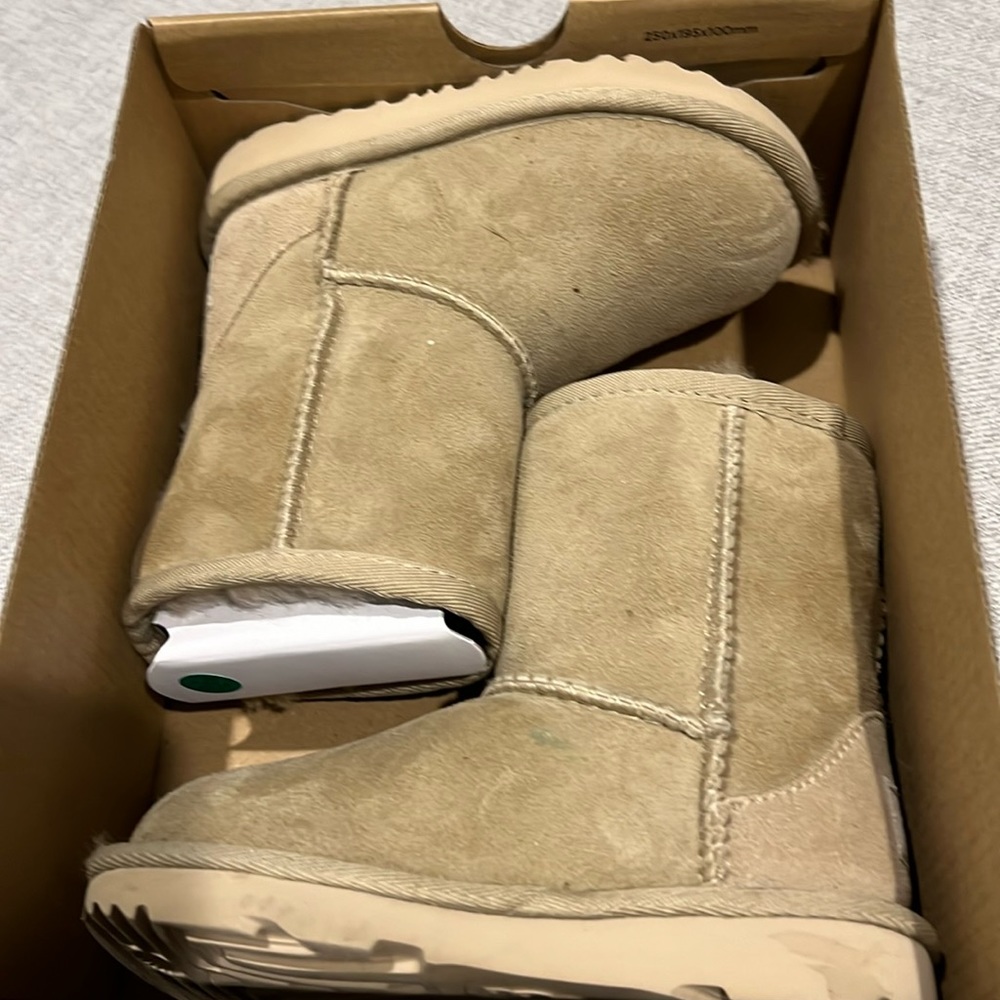 Used Ugg Toddler size 8 Classic II tan/cream color.